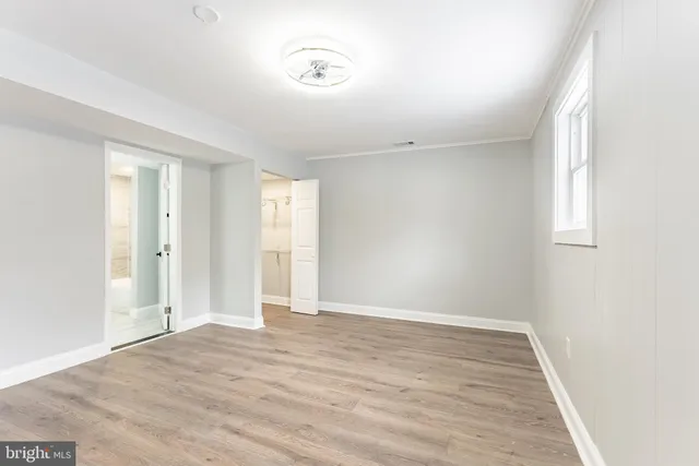 a work room with furniture and wooden floor