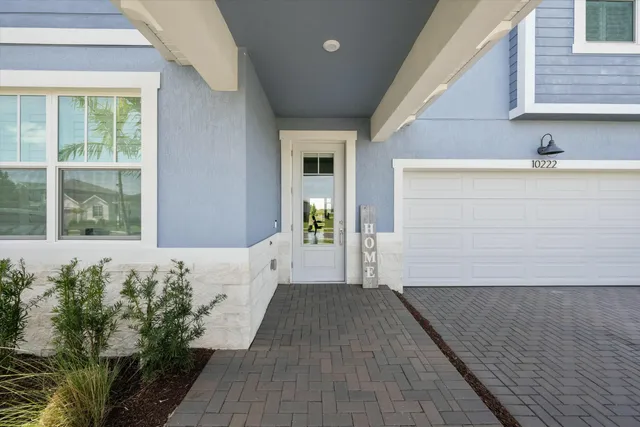 a view of living room with furniture and wooden floor