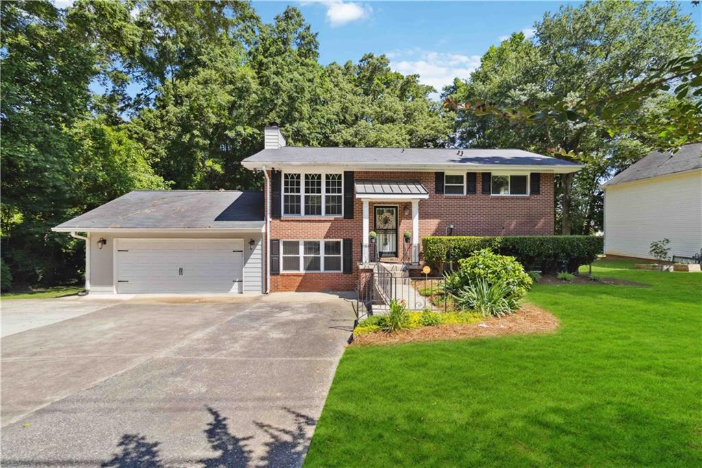 2868 River Road Decatur, GA 30034 - Photo 1 of 1 a front view of a house with a garden