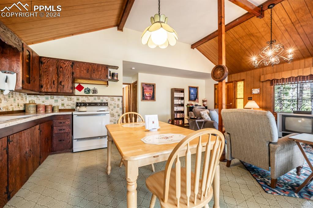 441 Westcliffe Drive Rye, CO 81069 - Photo 11 of 29 a open kitchen with stainless steel appliances granite countertop a stove and a refrigerator