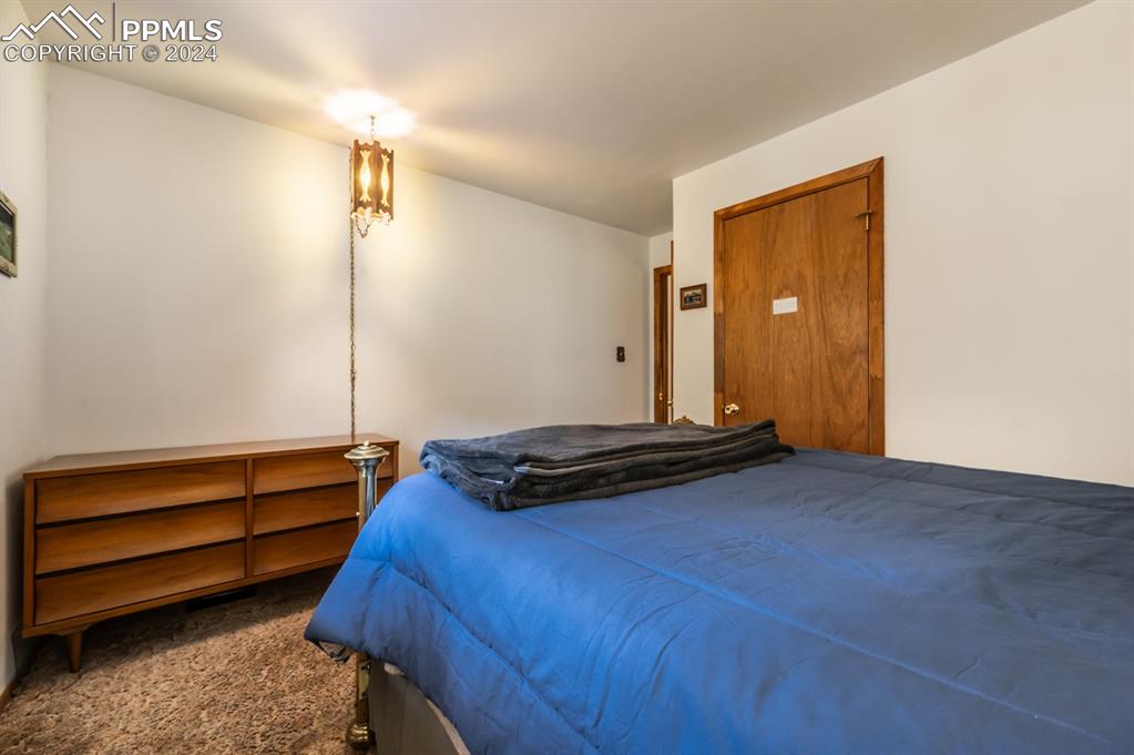441 Westcliffe Drive Rye, CO 81069 - Photo 16 of 29 a bedroom with a bed and a window
