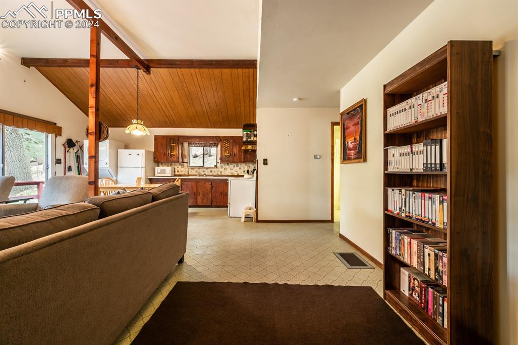 441 Westcliffe Drive Rye, CO 81069 - Photo 4 of 29 a view of a living room and a book shelf