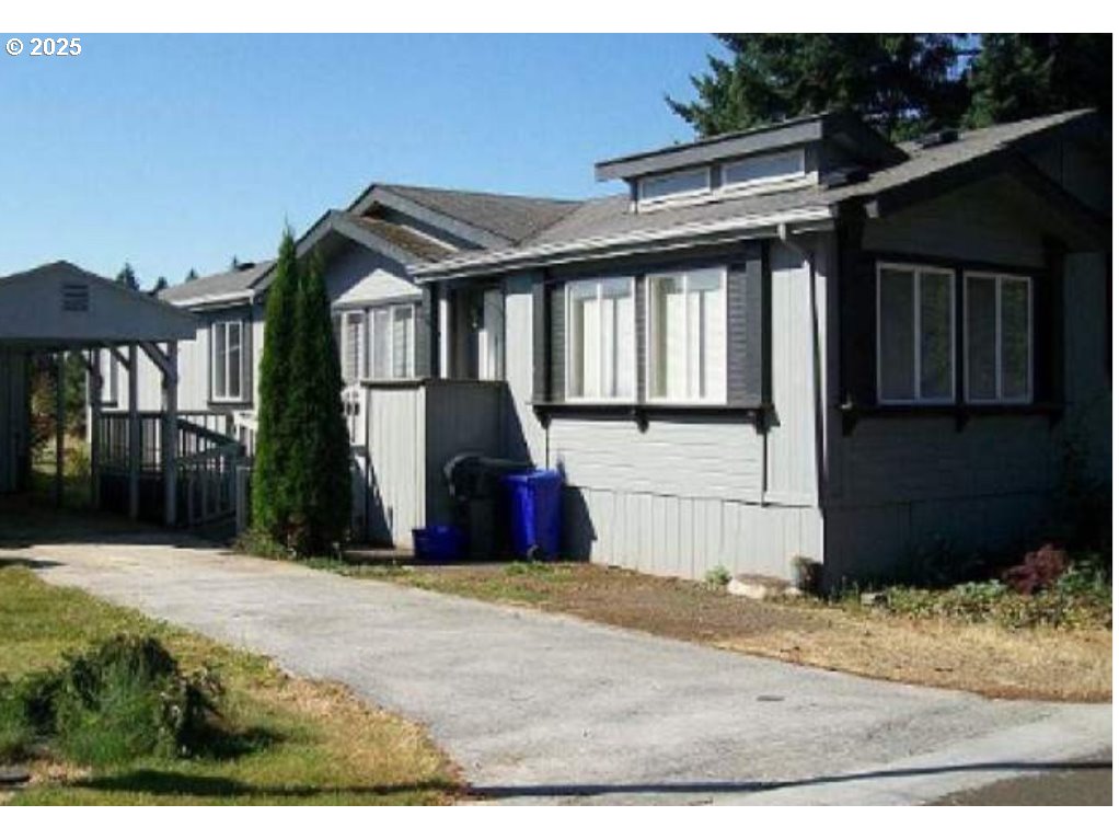 a view of a house with a backyard