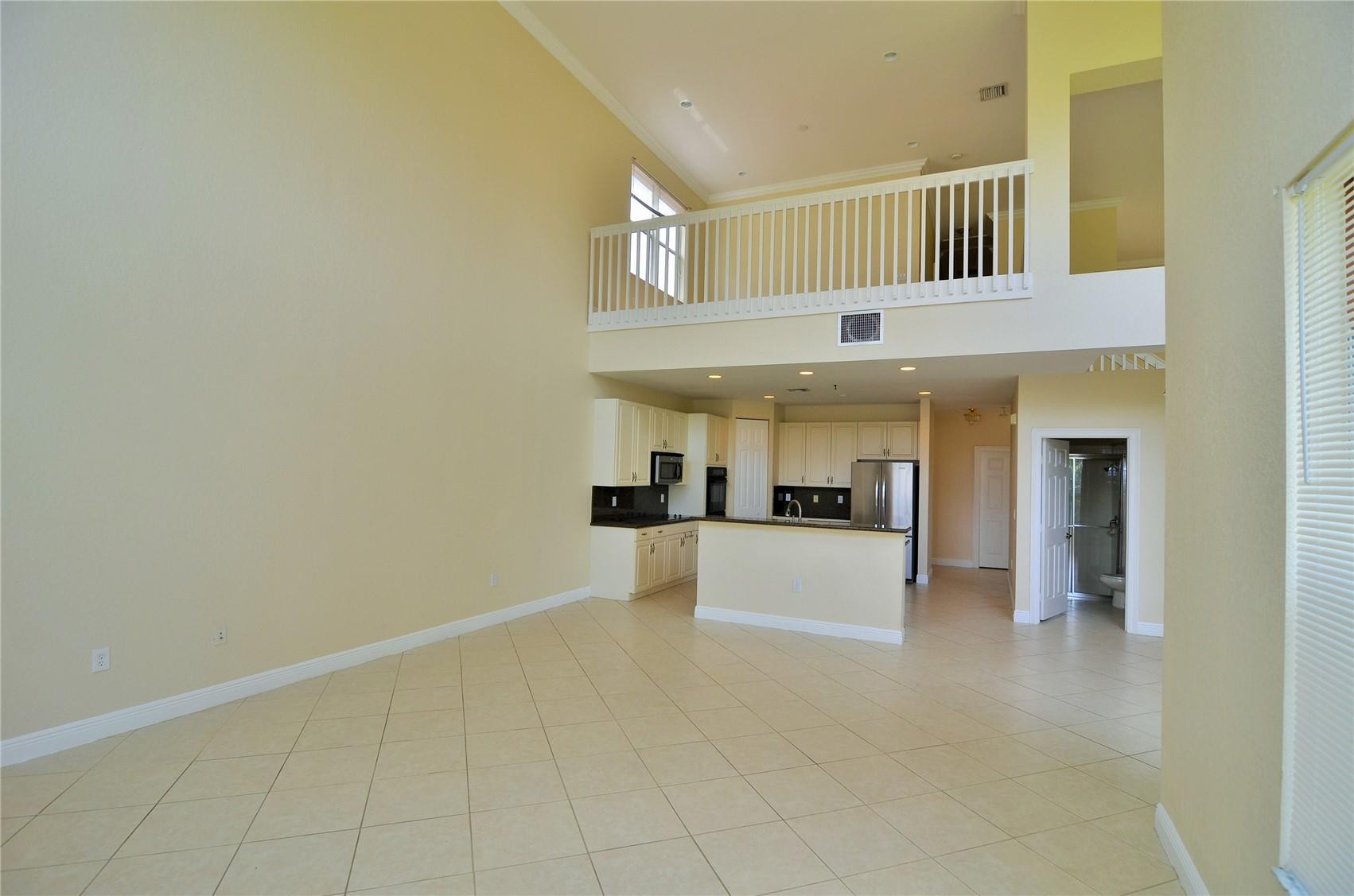 5455 Southwest 191st Terrace Miramar, FL 33029 - Photo 11 of 20 a view of a hallway with furniture and cabinets