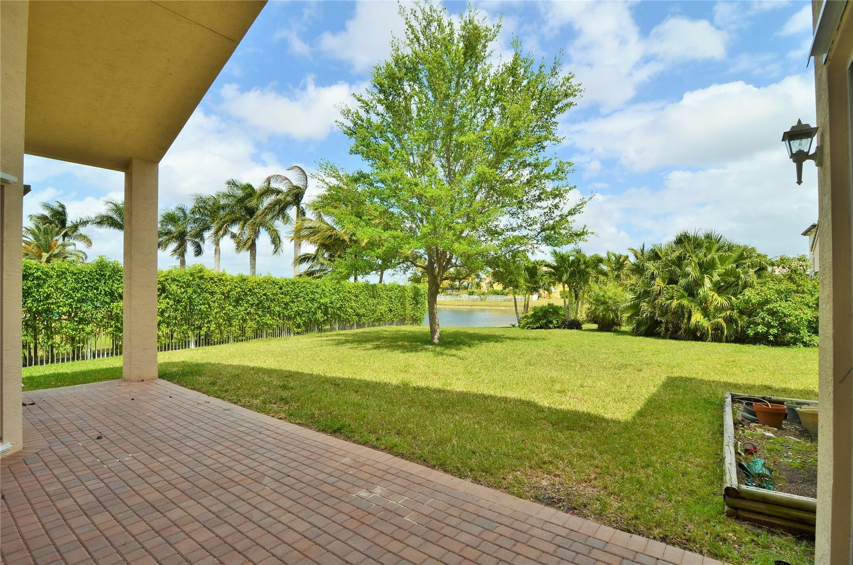 5455 Southwest 191st Terrace Miramar, FL 33029 - Photo 17 of 20 a view of a field with a tree