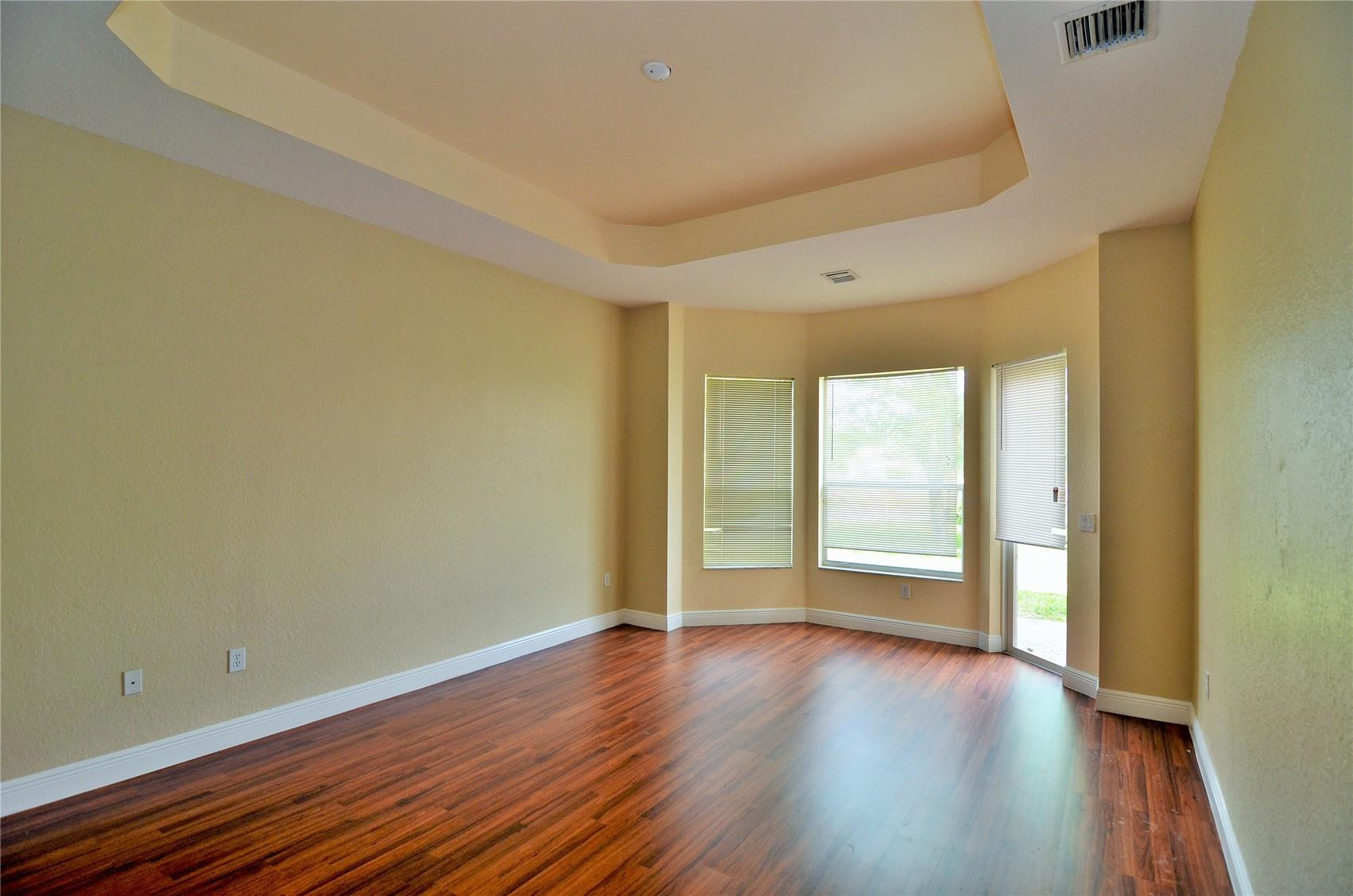 5455 Southwest 191st Terrace Miramar, FL 33029 - Photo 3 of 20 a view of an empty room with wooden floor and a window
