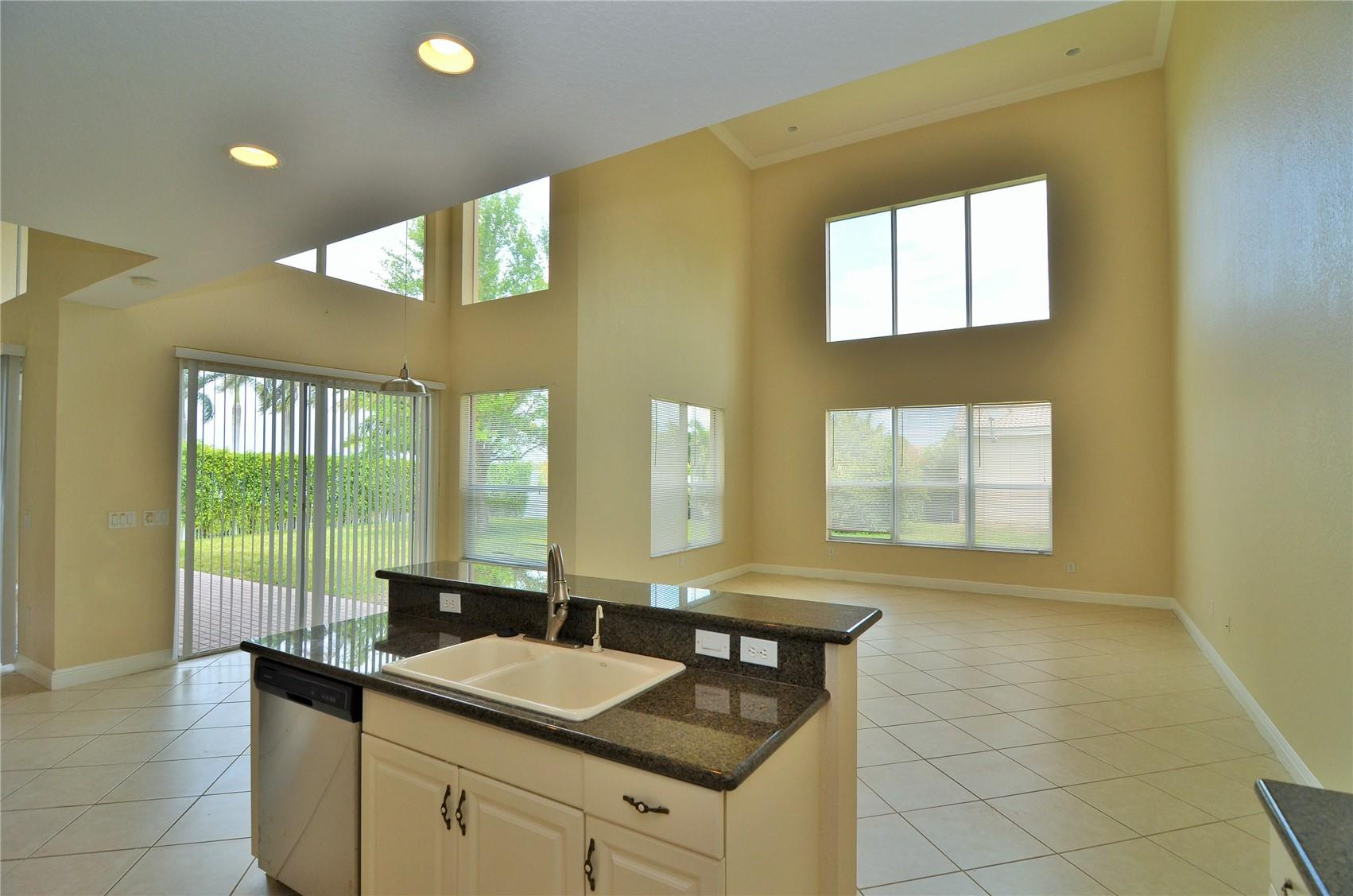5455 Southwest 191st Terrace Miramar, FL 33029 - Photo 8 of 20 a bathroom with a granite countertop sink and a large mirror