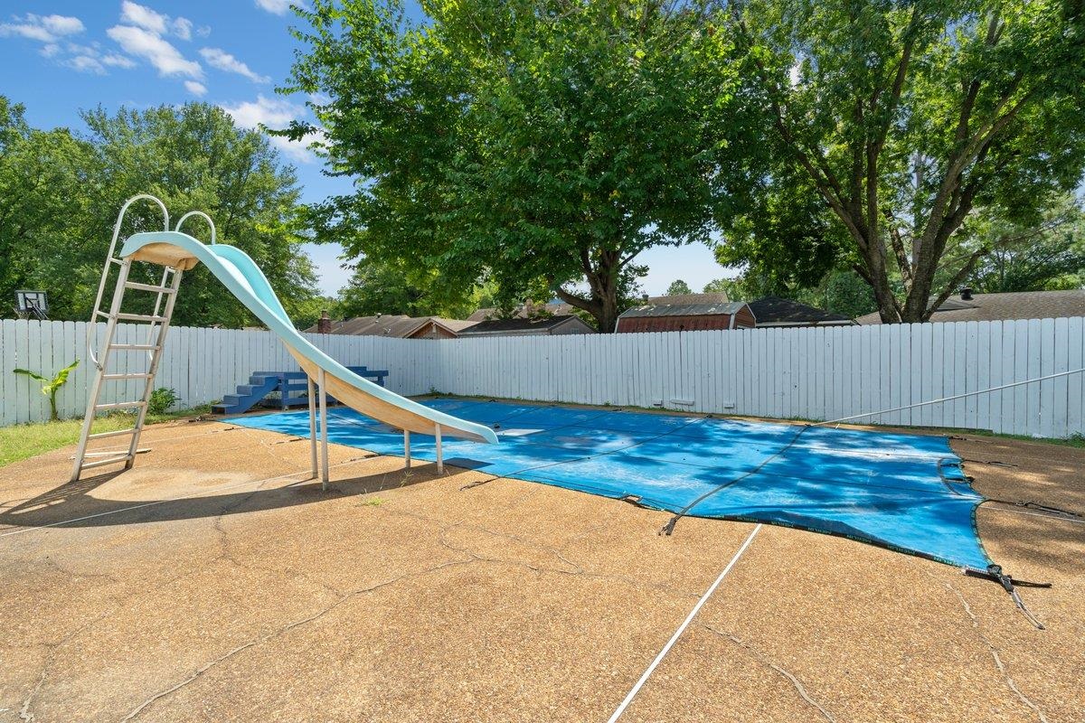 3384 South Mendenhall Road Memphis, TN 38115 - Photo 20 of 22 View of swimming pool with a patio area and a water slide