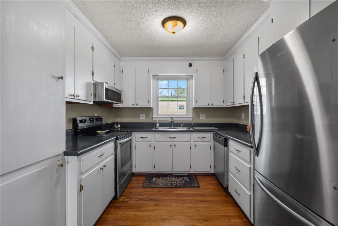 300 Green Street Williamston, SC 29697 - Photo 10 of 47 This spacious kitchen offers ample cabinet storage and modern appliances for everyday convenience.