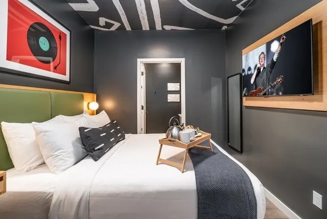 a living room with stainless steel appliances kitchen island furniture and a window