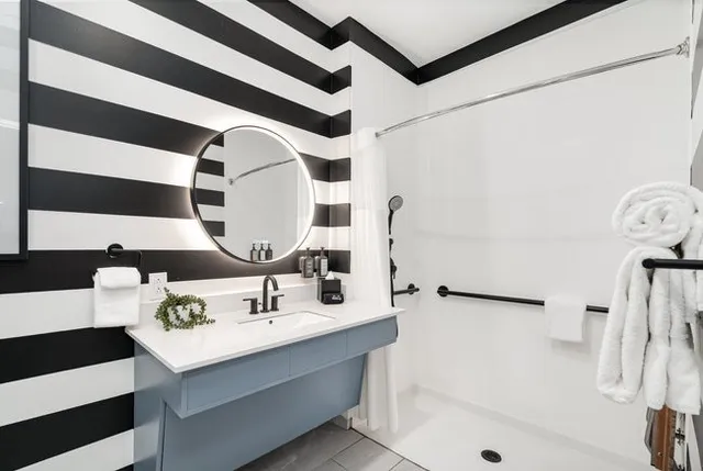 a bathroom with a sink and a mirror