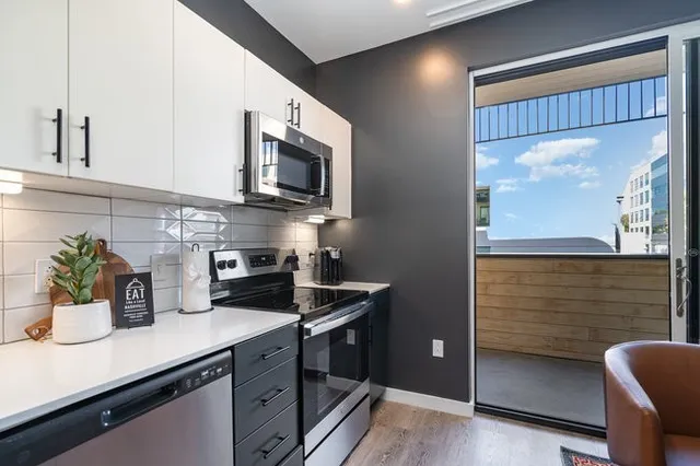 a kitchen with a sink and refrigerator