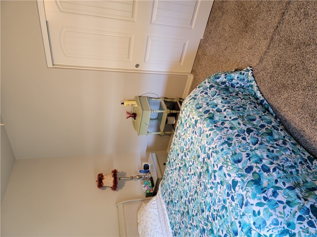 5414 Eagle View Road Kingman, AZ 86409 - Photo 30 of 39 Carpeted bedroom with baseboards and a closet