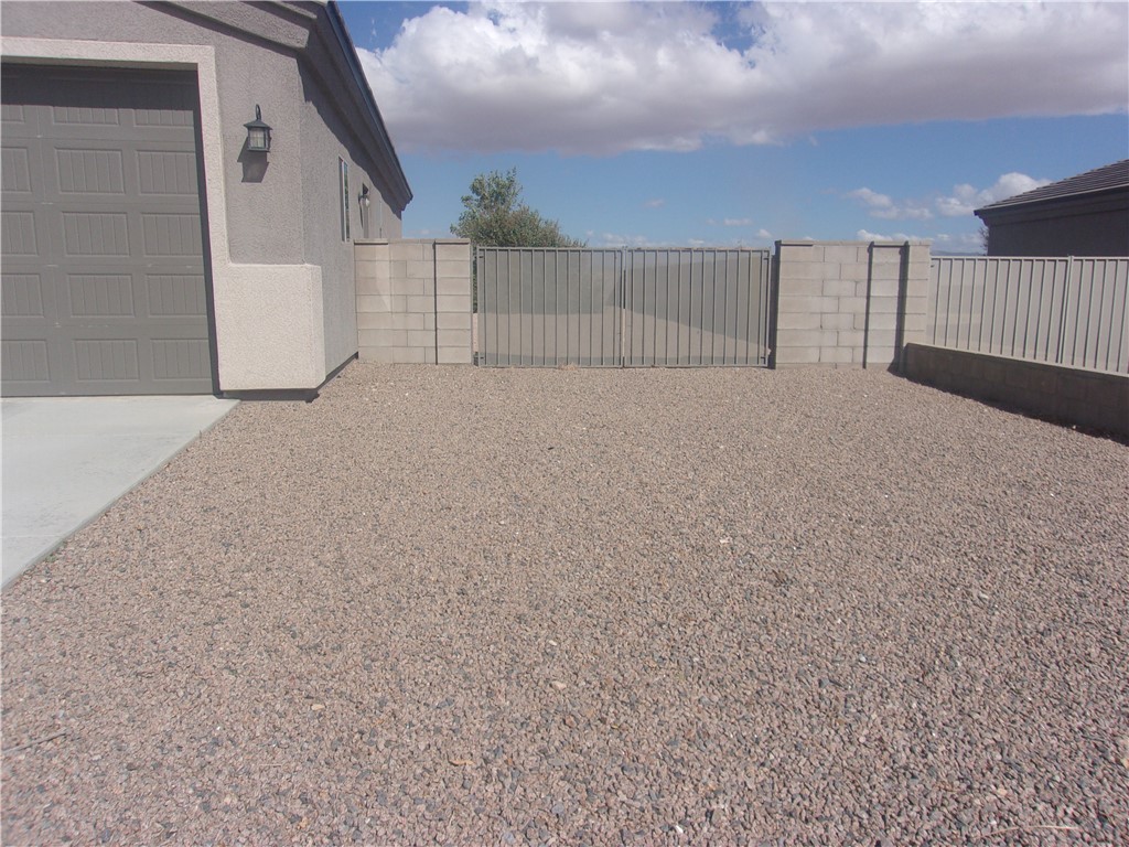 5414 Eagle View Road Kingman, AZ 86409 - Photo 3 of 39 View of yard featuring a gate