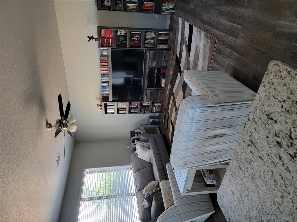 5414 Eagle View Road Kingman, AZ 86409 - Photo 33 of 39 Living room with a textured ceiling, dark wood-style floors, and ceiling fan