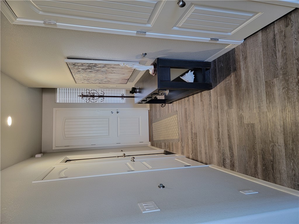 5414 Eagle View Road Kingman, AZ 86409 - Photo 34 of 39 Corridor with a textured wall, wood finished floors, and recessed lighting