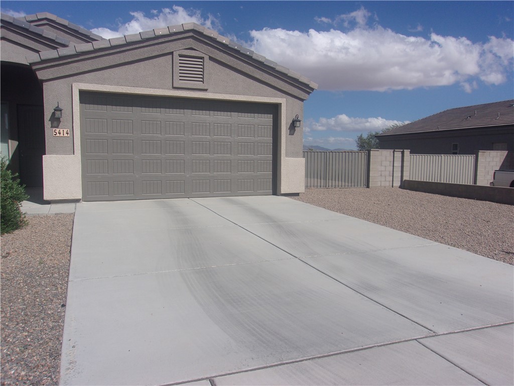 5414 Eagle View Road Kingman, AZ 86409 - Photo 5 of 39 Garage featuring concrete driveway