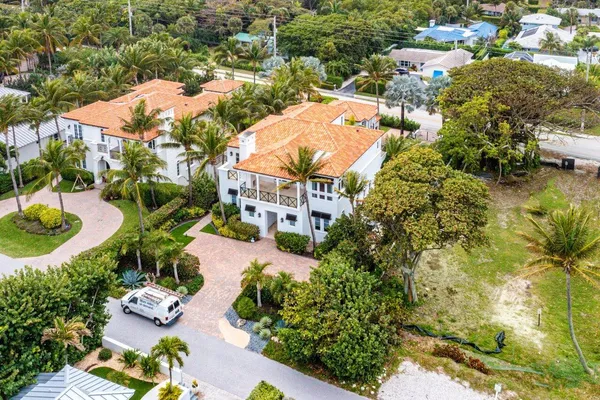 an aerial view of residential houses with outdoor space