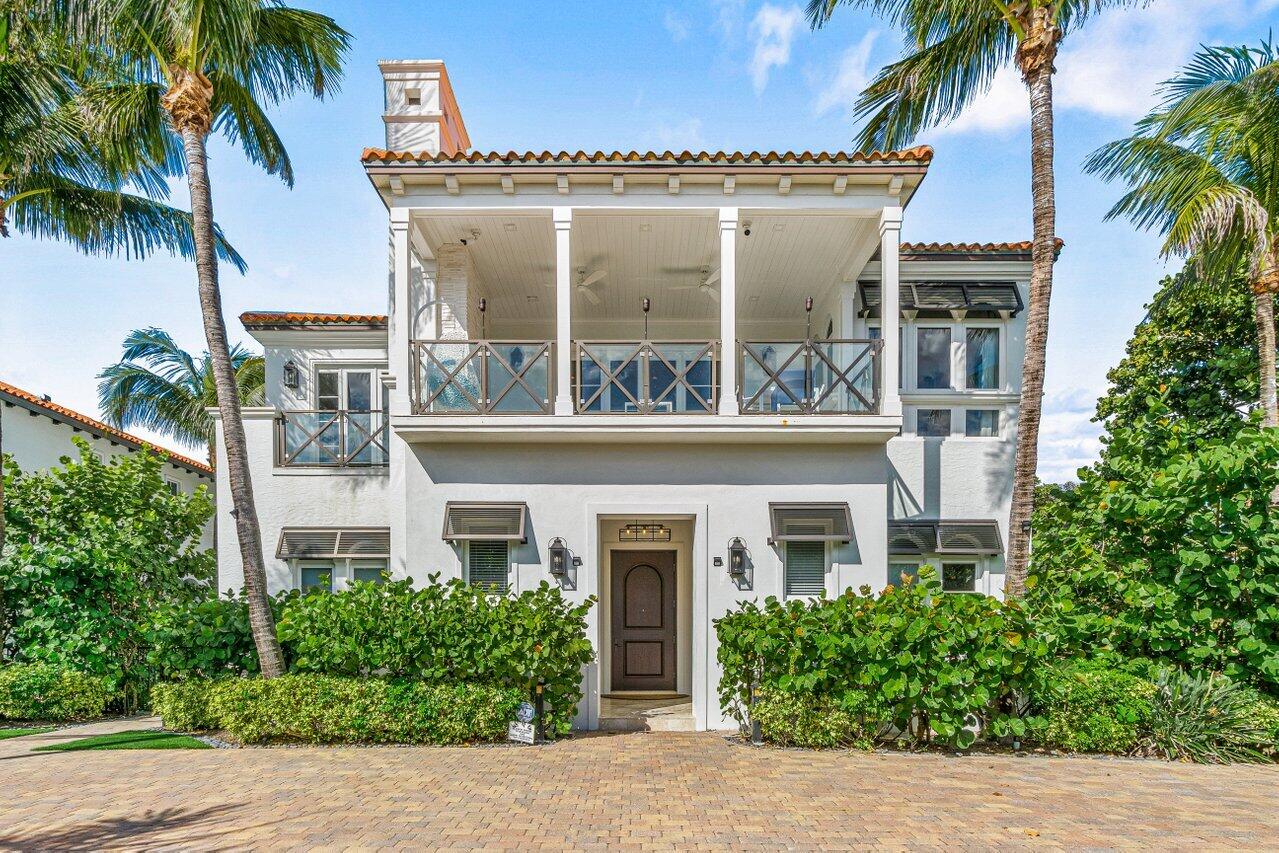 6103 North Ocean Boulevard Ocean Ridge, FL 33435 - Photo 7 of 53 front view of a building with a garden