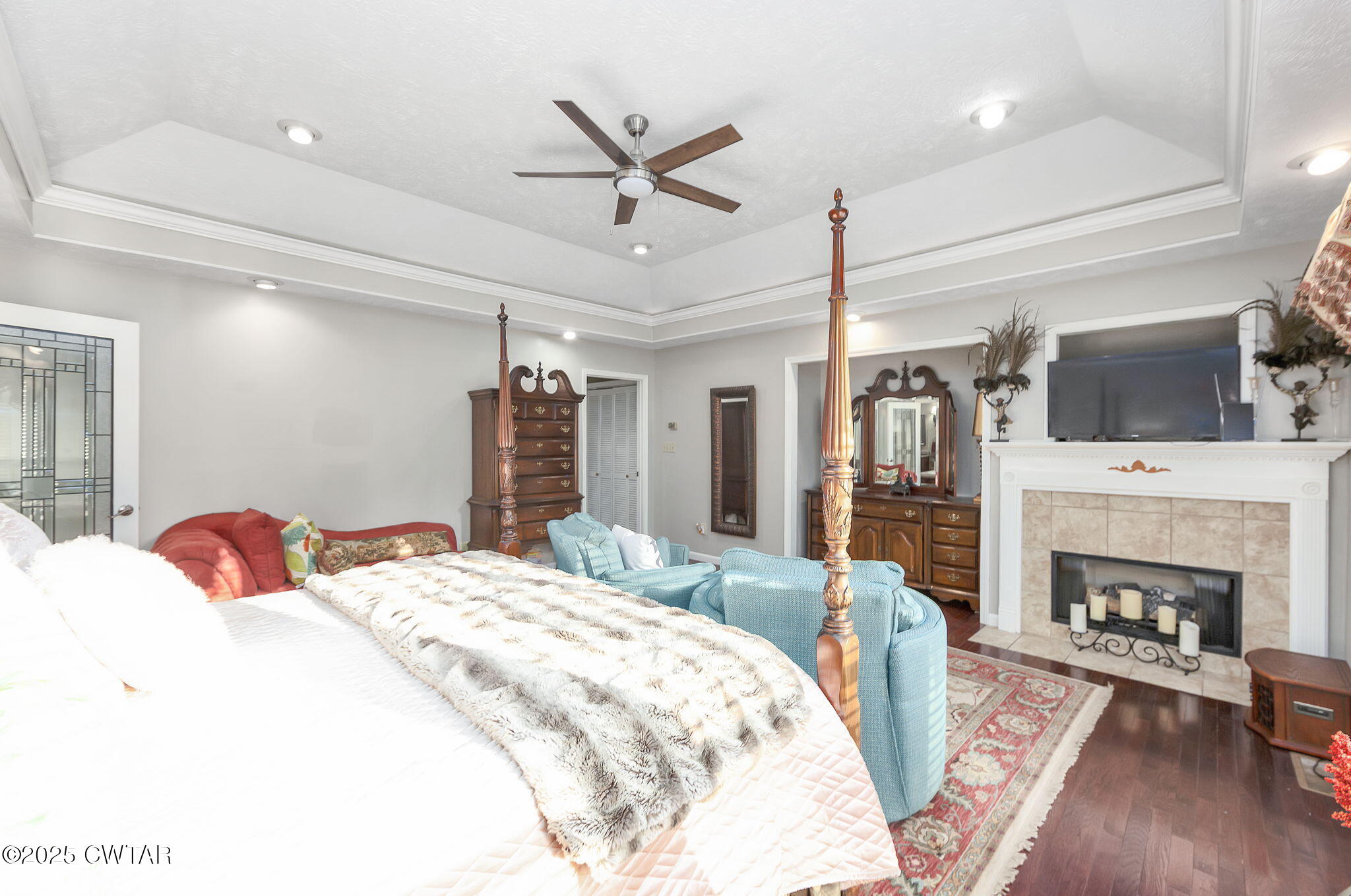 472 Old Denmark Road Jackson, TN 38301 - Photo 14 of 44 a bedroom with a bed and a fireplace