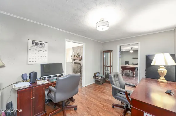 a living room with furniture or couch and a dining table