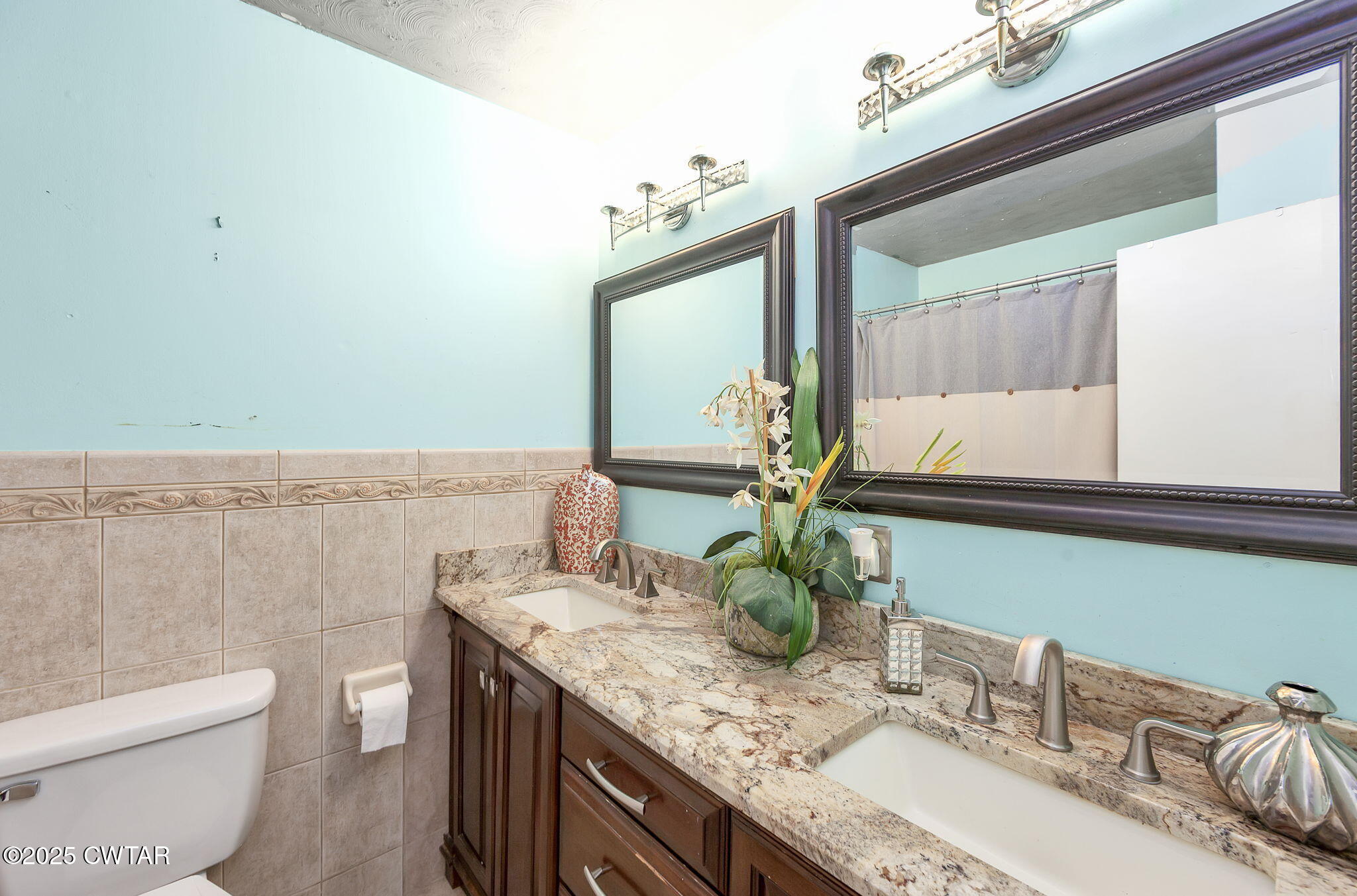 472 Old Denmark Road Jackson, TN 38301 - Photo 25 of 44 a bathroom with a granite countertop sink a toilet and mirror