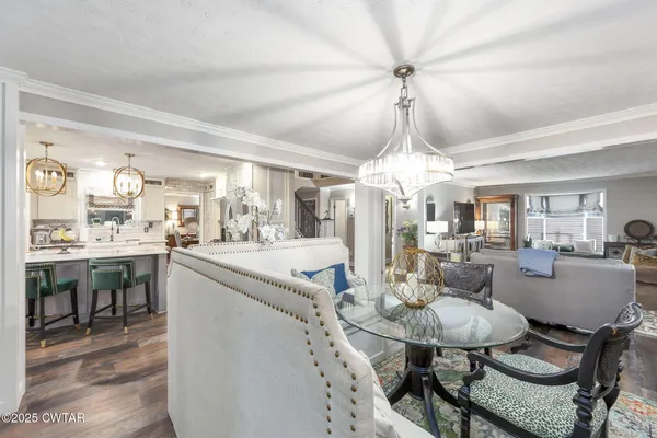 a swimming pool with outdoor seating and yard