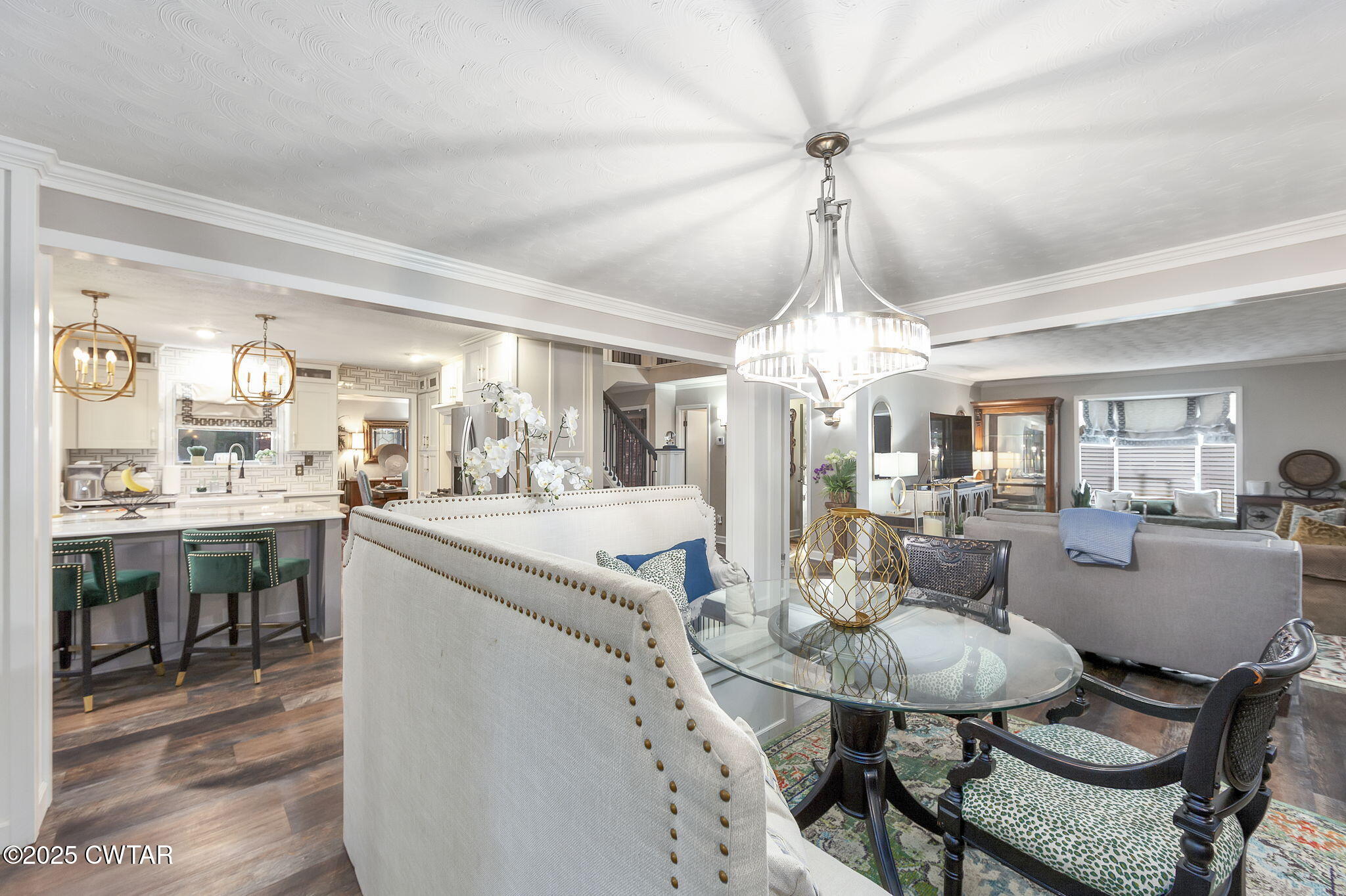 472 Old Denmark Road Jackson, TN 38301 - Photo 30 of 44 a dining room with wooden floor a chandelier a wooden table and chairs