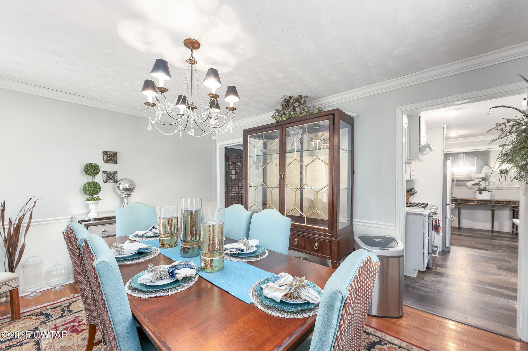 472 Old Denmark Road Jackson, TN 38301 - Photo 3 of 44 a view of a dining room with furniture a chandelier and wooden floor