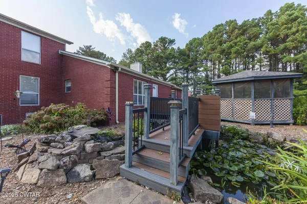 a view of a car park in front of a house