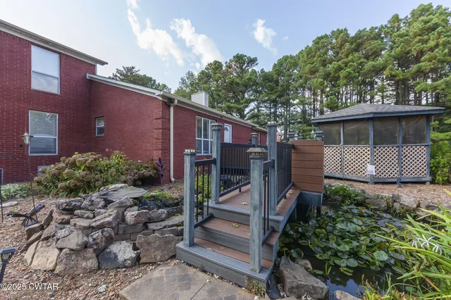 a view of a car park in front of a house