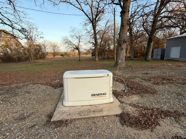 a view of a tiny house with a yard