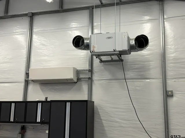 a bathroom with a shower and a mirror