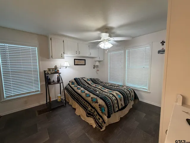 a bedroom with a bed and a table