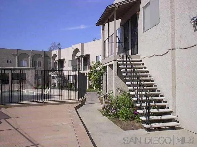 1604 Montecito Road, Unit 6 Ramona, CA 92065 - Photo 1 of 11 a view of a building with wooden fence