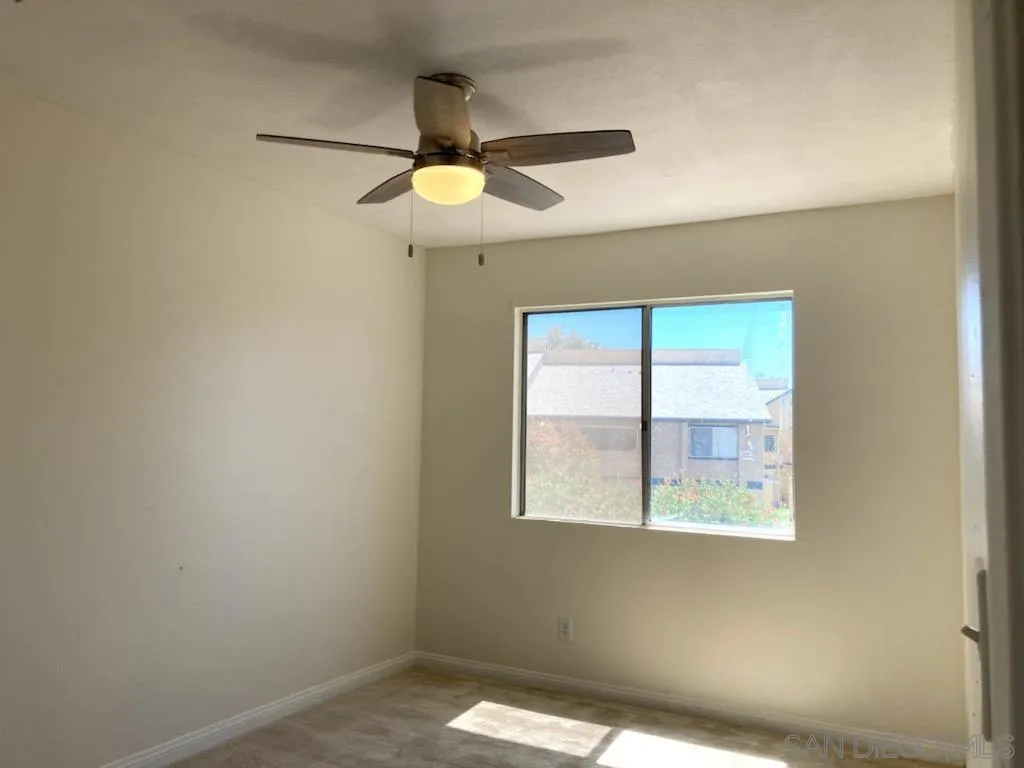 1604 Montecito Road, Unit 6 Ramona, CA 92065 - Photo 7 of 11 an empty room with windows and fan