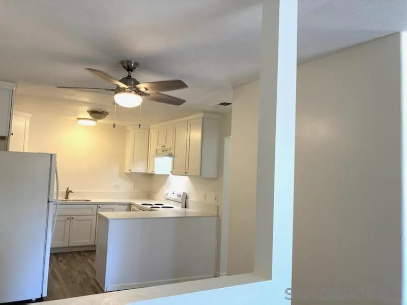 1604 Montecito Road, Unit 6 Ramona, CA 92065 - Photo 8 of 11 a bathroom with a granite countertop sink and a mirror