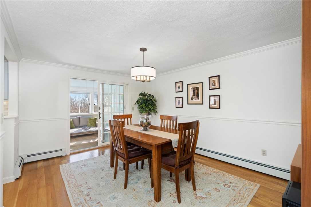 5 Eagle Run, Unit C Warwick, RI 02818 - Photo 10 of 32 Dining room with sliders to the fabulous sunroom