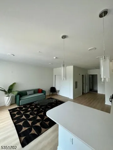 a kitchen with stainless steel appliances a stove a sink a counter space and cabinets