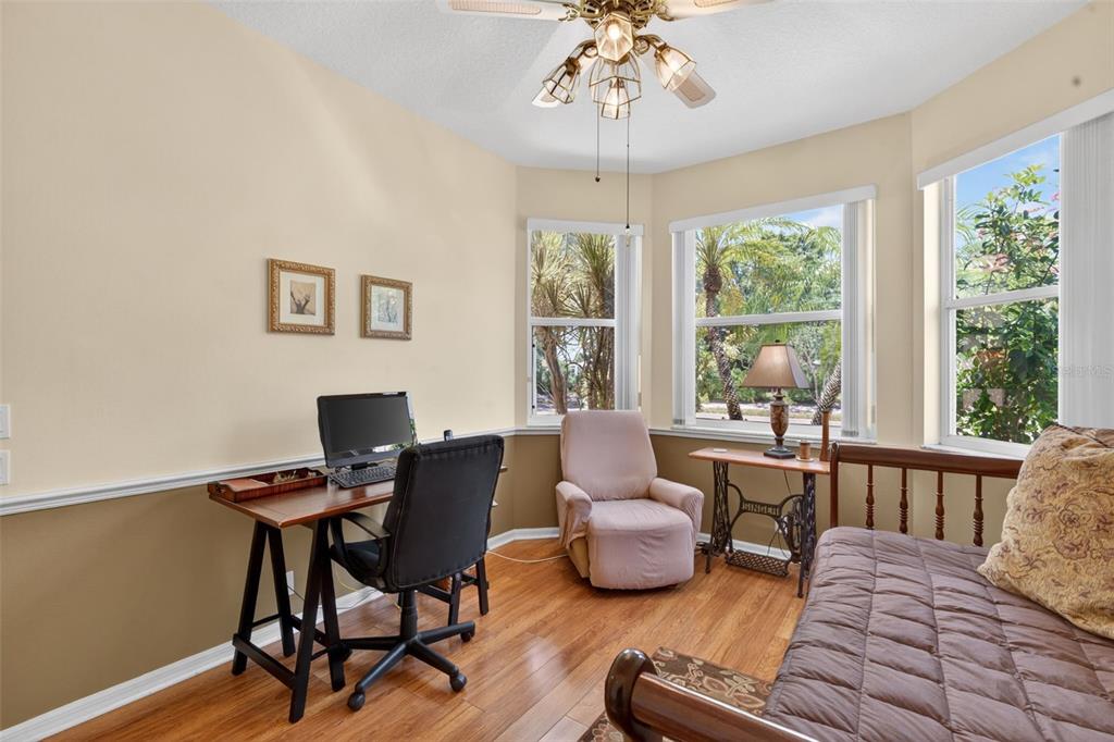 4266 Summertree Road Venice, FL 34293 - Photo 29 of 64 a view of a livingroom with furniture window and wooden floor