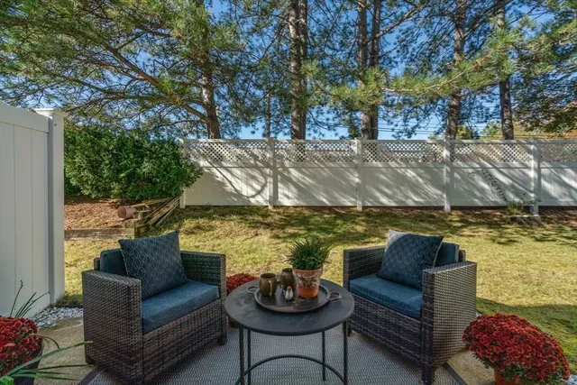 a outdoor living with furniture and a potted plant