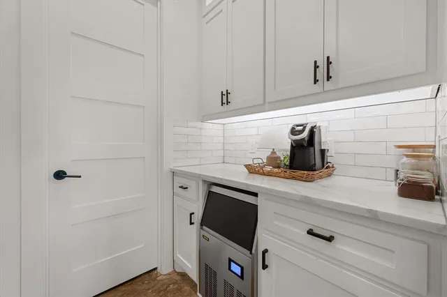 a kitchen with a sink and cabinets