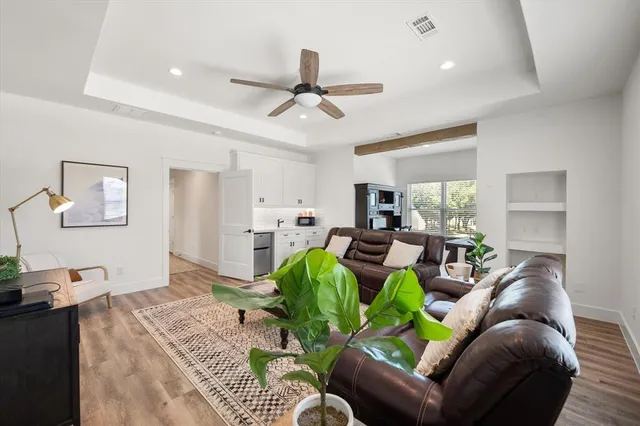 a view of a patio with lawn chairs and a potted plant