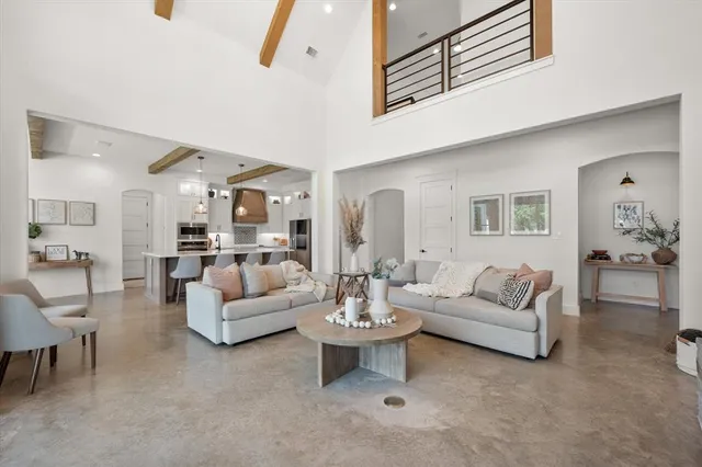 a living room with furniture white walls and white walls