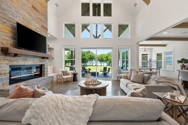a living room with fireplace furniture and a flat screen tv