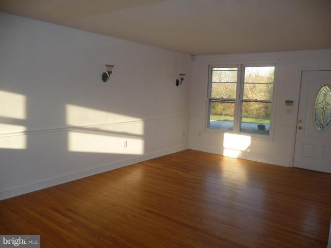 5193 Old Solomons Island Road Lothian, MD 20711 - Photo 6 of 22 Livingn Room with Hardwood Floors