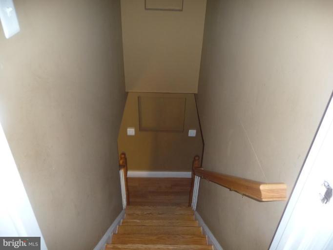 5193 Old Solomons Island Road Lothian, MD 20711 - Photo 10 of 22 Stairs to basement w/Hardwood