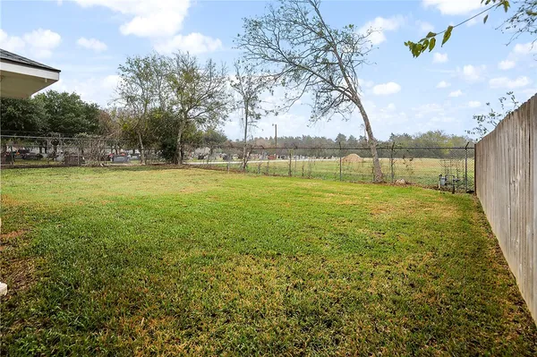a view of a big yard with a fountain