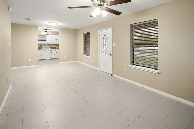 a view of an empty room with a window