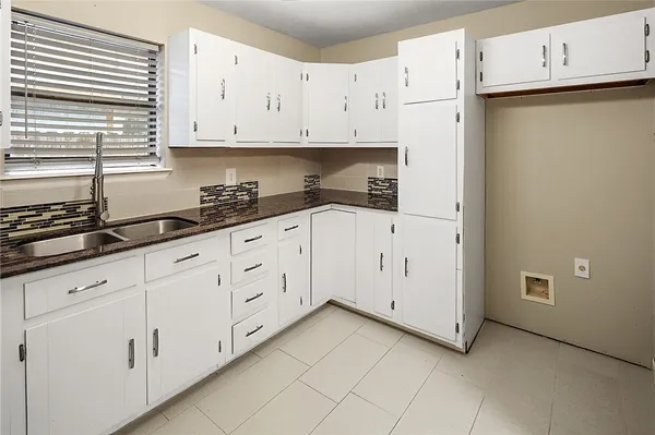 a view of cabinets with wooden floor